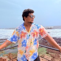 Milind B